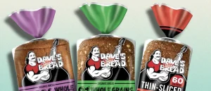 3 different loaves of Dave's Killer Bread sitting next to each other and looking delightfully fully and delicious.